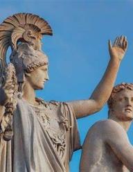 A statue of Athena against a blue sky
