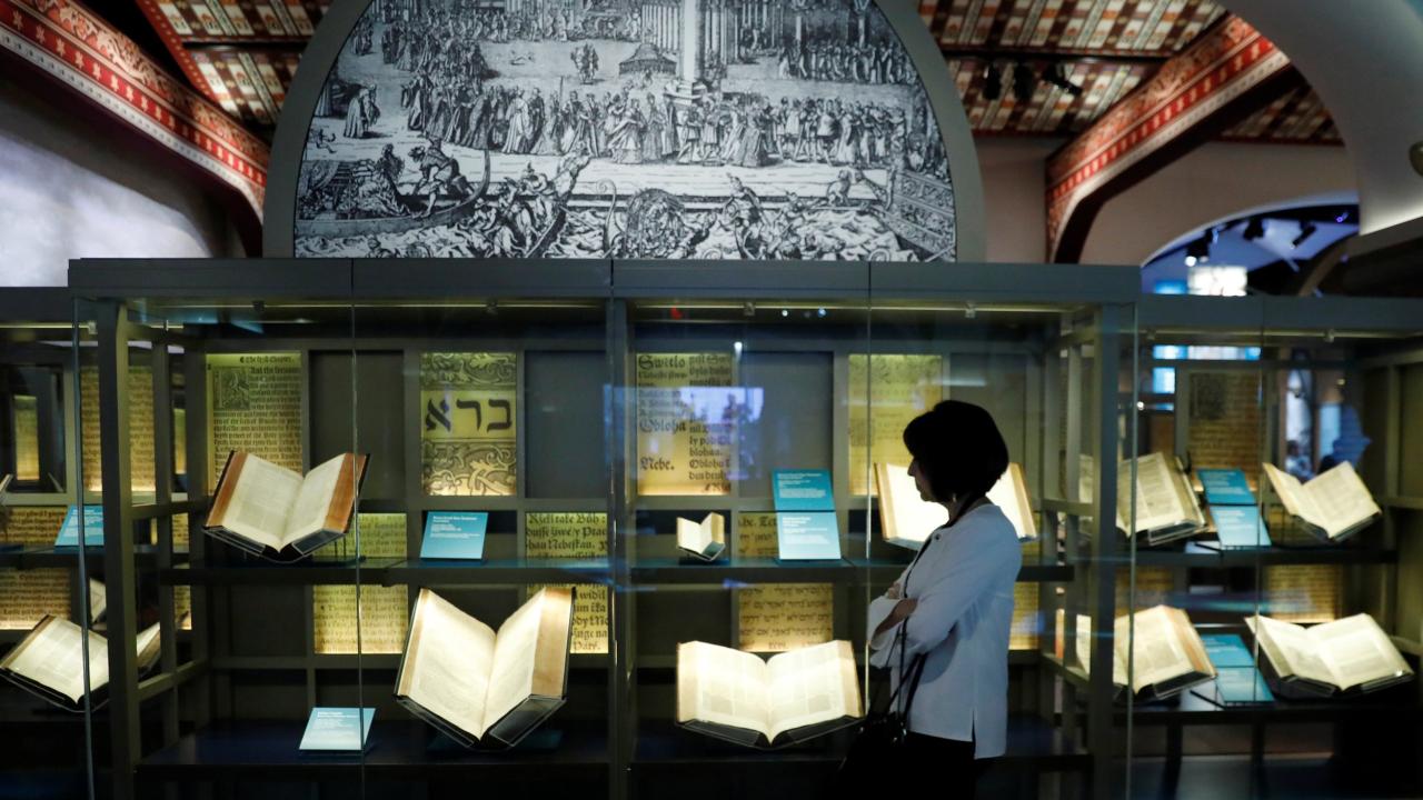 A museum display of multiple bibles