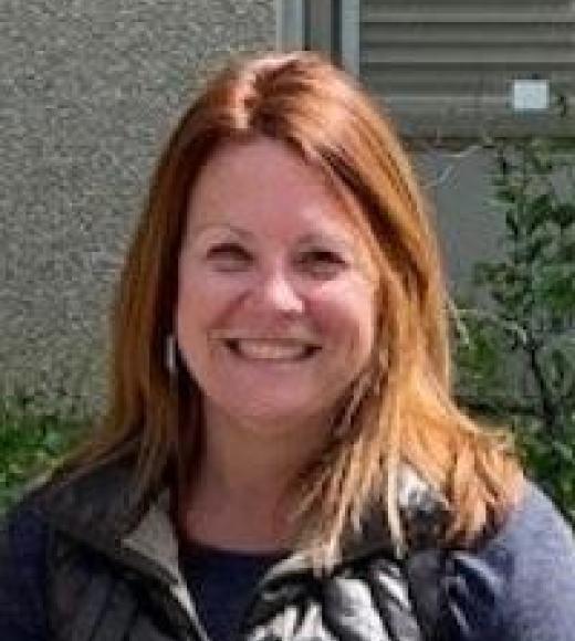A woman smiling at the camera