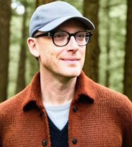 Man wearing baseball cap in the woods