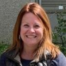 A woman smiling at the camera